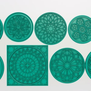 May include: Nine teal blue decorative round and square stencils with intricate geometric designs, resembling stained glass windows.