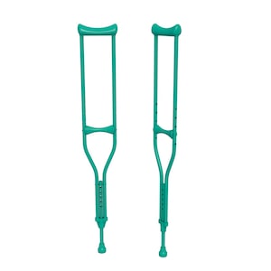 May include: Two teal-colored crutches are displayed against a white background. The crutches have adjustable height settings and padded armrests. They are designed to provide support and mobility assistance.