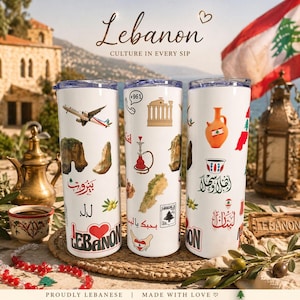 May include: Three white travel mugs featuring Lebanese designs, including a plane, landmarks, and Arabic script. The mugs have a silver rim and a clear lid. The text "Lebanon" and "Culture in Every Sip" are displayed on the mugs.