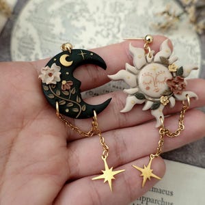 fairycore, pastel goth, mushroom decor, nature inspired, boho charm, celestial vibes, magical creature, herbology, enchanted forest, moonchild, spiritual gift, witchy aesthetic, moon phases, cottage witch, dreamy charm, rustic jewelry, terrarium style, fantasy charm, garden witch, starry night, luna moth, folk art jewelry, springtime vibes, tiny treasures, cozy decor, handmade aesthetic, fae realm, mystical charm, woodland magic, celestial gift, dark cottagecore witch Sun and Moon