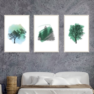 May include: Three framed art prints featuring watercolor tree designs. The prints showcase trees in shades of green and blue against a white background. The frames have a neutral color, and the artwork is displayed above a bed.