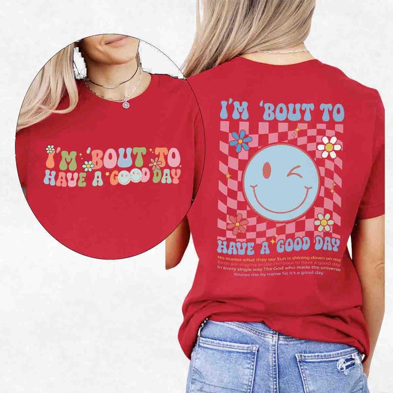 May include: Red t-shirt with the text "I'M 'BOUT TO HAVE A GOOD DAY" in a retro font. The back of the shirt features a smiley face, flowers, and a checkered pattern. The shirt also has a quote about the sun and God.