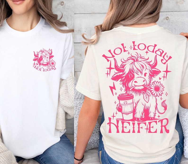 May include: Two white t-shirts with a pink graphic of a Highland cow. The front shirt has the text "Not today" and the back shirt has the text "Not today HEIFER".