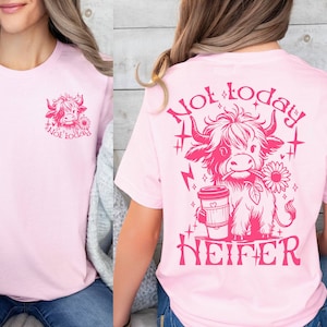 May include: Pink t-shirt with a pink graphic of a cow holding a coffee cup and a flower. The text "Not today, Heifer" is printed on the shirt.