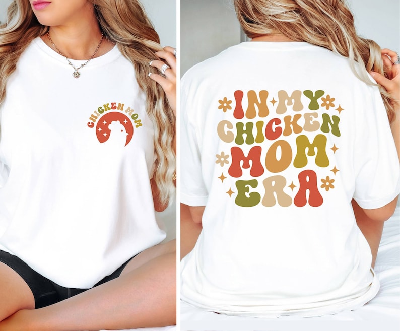May include: White t-shirt with a retro-style graphic that says "Chicken Mom" on the front and "In My Chicken Mom Era" on the back.