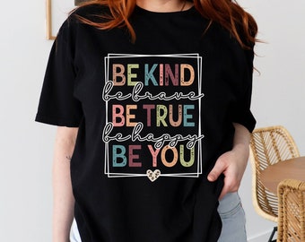 May include: Black t-shirt with a white framed graphic that reads "BE KIND be brave BE TRUE be happy BE YOU" in colorful text with a small heart design.