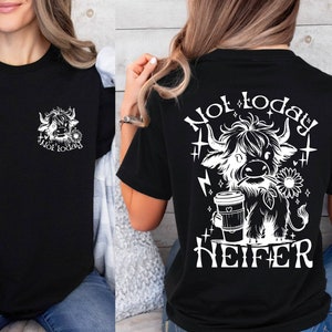 May include: Black t-shirt with a white graphic of a Highland cow holding a coffee cup and the text "Not today, Heifer".