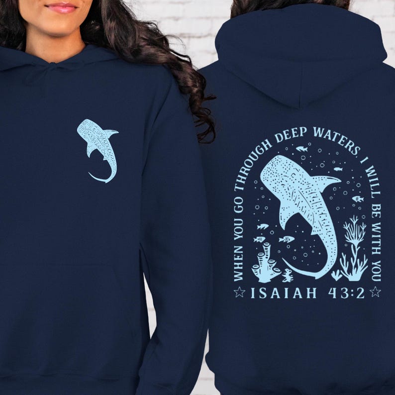 May include: Navy blue hoodie with a light blue whale shark graphic on the front and back. The back features the text "When you go through deep waters, I will be with you. Isaiah 43:2."