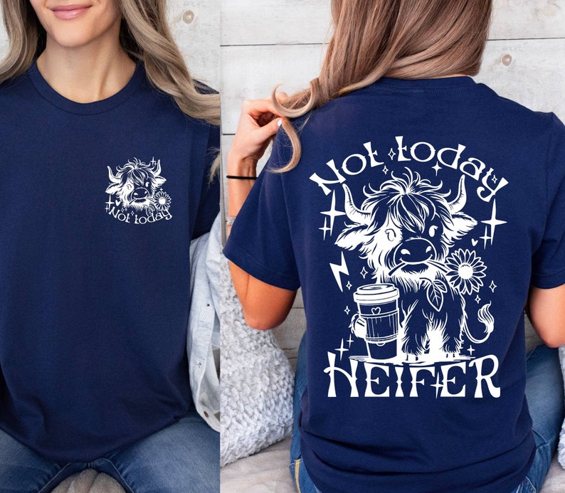May include: A navy blue t-shirt with a white graphic of a Highland cow holding a coffee cup and the text "Not today heifer".