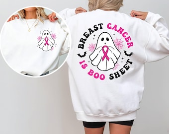 以下が含まれることがあります： 前面にピンクのリボンと幽霊のグラフィック、後ろに「Breast Cancer is Boo Sheet」という文字が書かれた白いスウェットシャツです。