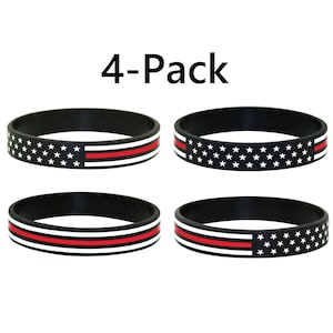 May include: Four black silicone bracelets with a red line and white stars representing the American flag. The bracelets are arranged in two rows of two. The text "4-Pack" is printed above the bracelets.