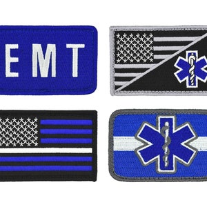 May include: Four embroidered patches with a blue, white, and black color scheme. The patches feature the words "EMT", a stylized American flag with a medical symbol, a thin blue line American flag, and a medical symbol on a blue background.