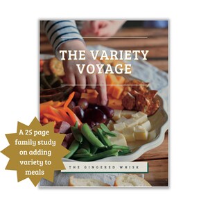 May include: A book cover with a photo of a child's hand reaching for a plate of food. The title of the book is "The Variety Voyage" and the subtitle is "A 25 page family study on adding variety to meals". The book is published by "The Gingered Whisk".