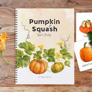 May include: A spiral-bound unit study book titled Pumpkin & Squash by Nimble Nests, featuring watercolour illustrations of orange and green pumpkins, vines, and yellow flowers, accompanied by two white flashcards showing a Turban squash and a pumpkin.
