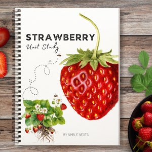 May include: A spiral-bound notebook titled "STRAWBERRY Unit Study" with a watercolor illustration of a large red strawberry. The image includes sliced strawberries, a strawberry plant illustration, and a bowl of fresh strawberries on a wooden surface.