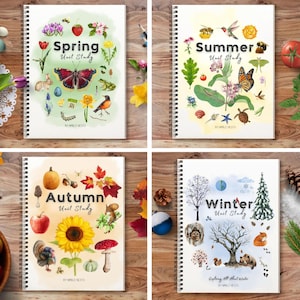 May include: Four spiral-bound unit study workbooks titled Spring, Summer, Autumn, and Winter. Each cover features watercolor illustrations of seasonal flora and fauna, including butterflies, flowers, animals, and trees, with the text By Humble Nest.