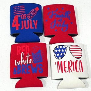 May include: Four patriotic can coolers in red, white, and blue. Designs include an American flag, fireworks, and text that reads "4th of July", "Red White & Brews", and "'Merica".
