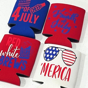 May include: Four beverage can coolers in red, white, and blue with patriotic designs. One cooler says "4th of July" and "Cheers", another says "Fourth of July", a third says "Red White Brews", and the last says "'Merica" with sunglasses.