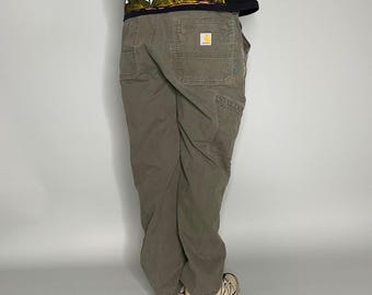Pantalones Carhartt Carpenter vintage de los años 90, talla 38x30, corte relajado, color verde oliva, rodillas reforzadas.
