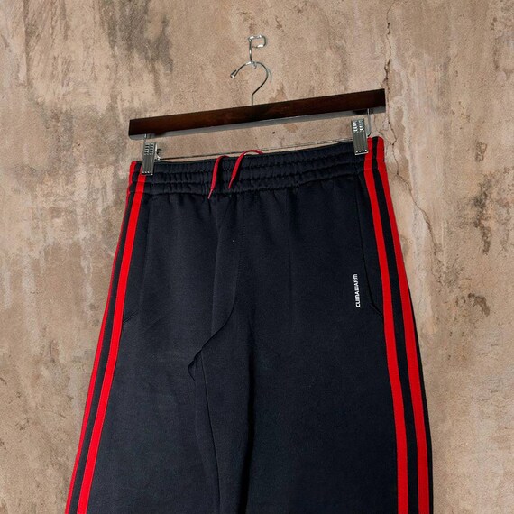 black adidas sweatpants with red stripes
