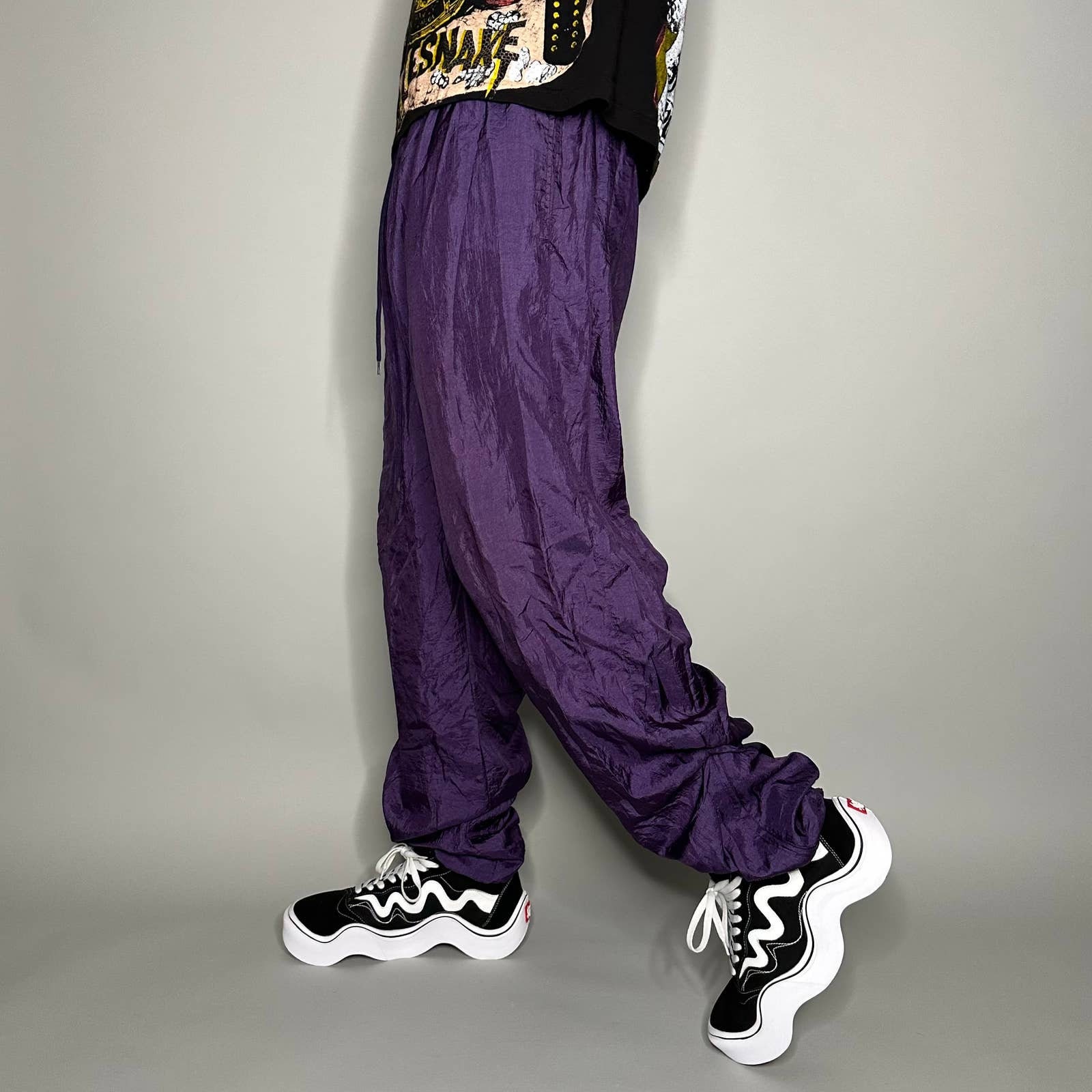 Stay stylish and comfortable in this vibrant purple track suit