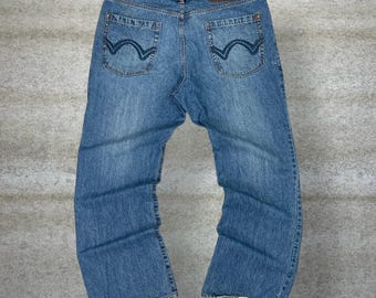 Vaqueros patinadores Micros vintage de 38 x 32, holgados, de pierna ancha y lavado medio.
