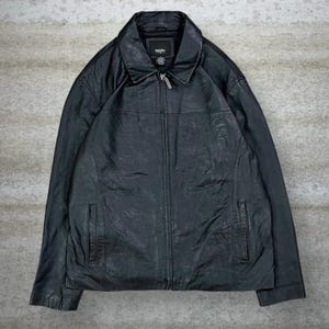 May include: A black leather jacket with a collared neckline and a full-length zipper. The jacket has two front pockets and a textured appearance. The brand name "Mossimo" is visible on a tag near the collar.