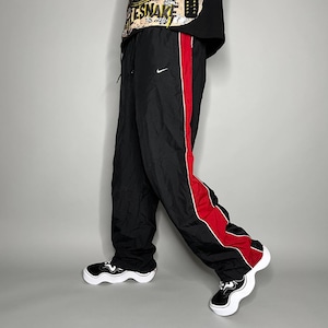 Nike striped track pants hotsell