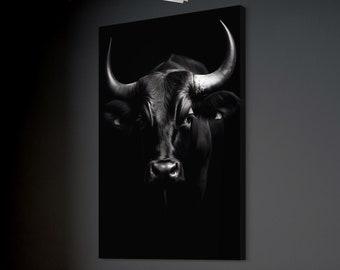 May include: A black and white photograph of a bull's head with large horns. The bull is looking directly at the camera with a serious expression.