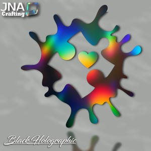 May include: A black holographic vinyl decal with a splatter design and a small yellow heart in the center. The decal says "Black Holographic" at the bottom.