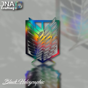 Puede incluir: Emblema hologr&aacute;fico negro con dise&ntilde;o de alas y degradado arco&iacute;ris. El emblema est&aacute; sobre un fondo gris. El texto "Black Holographic" est&aacute; en la parte inferior. El logotipo "JNA Crafting" est&aacute; en la parte superior izquierda.