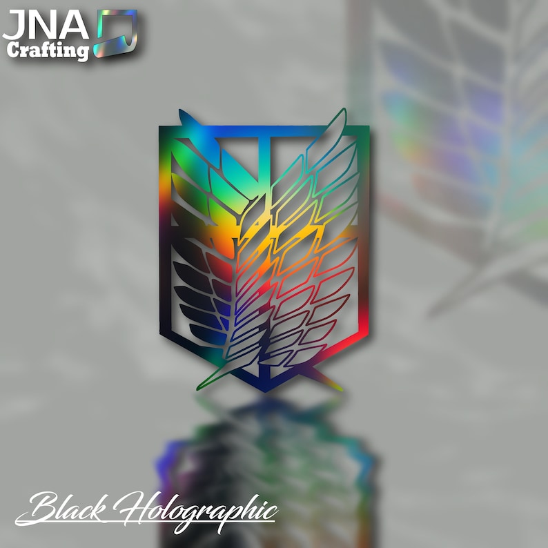 Puede incluir: Emblema hologr&aacute;fico negro con dise&ntilde;o de alas y degradado arco&iacute;ris. El emblema est&aacute; sobre un fondo gris. El texto "Black Holographic" est&aacute; en la parte inferior. El logotipo "JNA Crafting" est&aacute; en la parte superior izquierda.