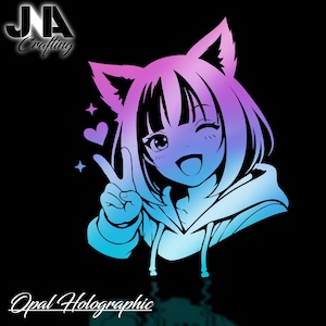 May include: A vibrant anime-style illustration of a girl with cat ears, winking and flashing a peace sign. The design features a gradient of pink, purple, and blue hues. The text "JA Crafting" and "Opal Holographic" are also present.