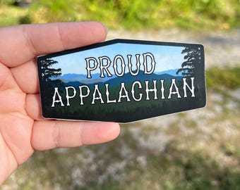 May include: A black and white sticker with a mountain range and the text "PROUD APPALACHIAN".