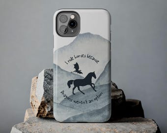 May include: A white phone case with a watercolor background of blue and gray mountains. The text "I ride horses because dragons weren't an option" is printed on the case. A silhouette of a horse and a dragon is also printed on the case.