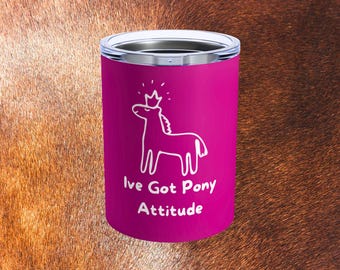 May include: A magenta tumbler with a silver rim features a white outline of a pony wearing a crown. The text "Ive Got Pony Attitude" is below the pony illustration. The tumbler is cylindrical and appears to be made of stainless steel.