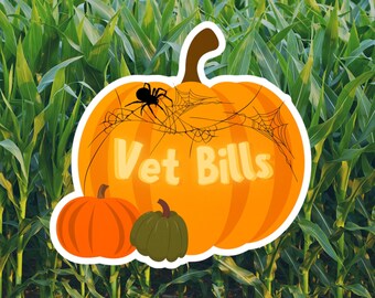 May include: A Halloween-themed sticker featuring a large orange pumpkin with the words "Vet Bills" in yellow. A black spider and spiderwebs are on the pumpkin. Two smaller pumpkins, one orange and one green, are below the large pumpkin.