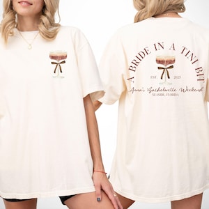 a bride in a tini bit decor, martini theme bachelorette favors, martini bachelorette, dirty martini bride, a tini bit tipsy bridal party tee