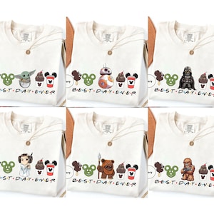 May include: Six white t-shirts with a graphic print of a Mickey Mouse ear ice cream cone, a character from Star Wars, and a cup of ice cream. The text "BEST DAY EVER" is printed below the graphic.