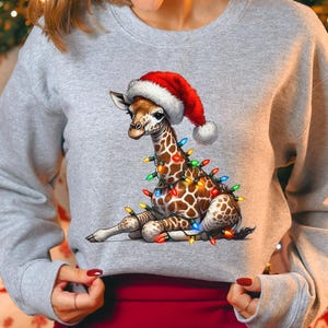 Cute Christmas Giraffe Lights Sweatshirt, Funny Holiday Animal Hoodie, Festive Lights Giraffe Hat Santa Gift Sweater, Xmas Giraffe Sweater