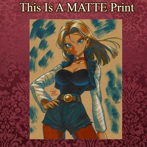 May include: A matte print featuring a stylized illustration of a blonde character with blue eyes, wearing a black top, dark blue shorts, and a cropped jacket with long white sleeves. The text "This Is A MATTE Print" appears at the top.