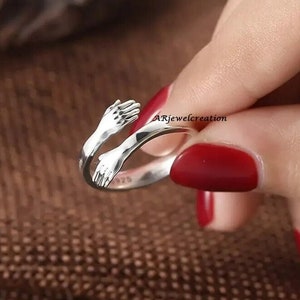 Sterling Silver or Gold Hand Hugging Ring, Embrace Ring
