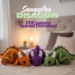 May include: Three crocheted dragon plushies in orange, purple, and green, each with white horns and large black eyes. The text "Snuggler Dragon PDF pattern Instant Download" is displayed above the dragons.