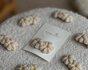 crocheted hair clip of two flowers in beige