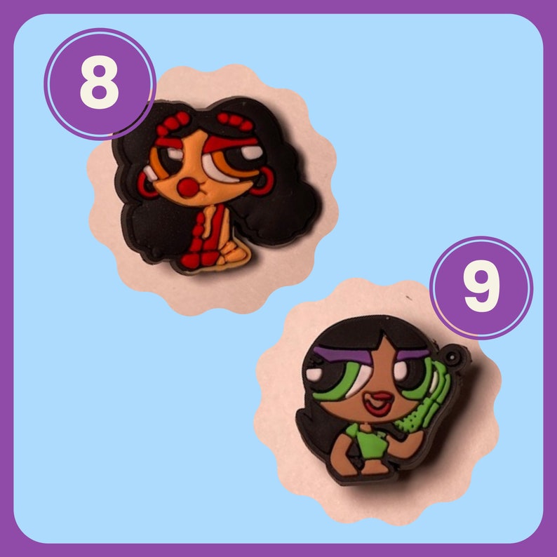 May include: Two cartoon character charms, one with black hair and red clothing, the other with black hair and green clothing. The charms are numbered 8 and 9.