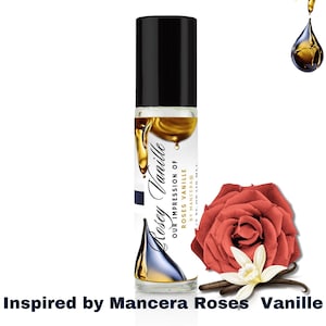 May include: A clear glass roll-on bottle with a black cap and a gold liquid inside. The bottle is labeled "Rosey Vanille Our Impression of Roses Vanille by Mancera® 1/2 FL. OZ (10 ML)". The image also includes a red rose and a vanilla bean.