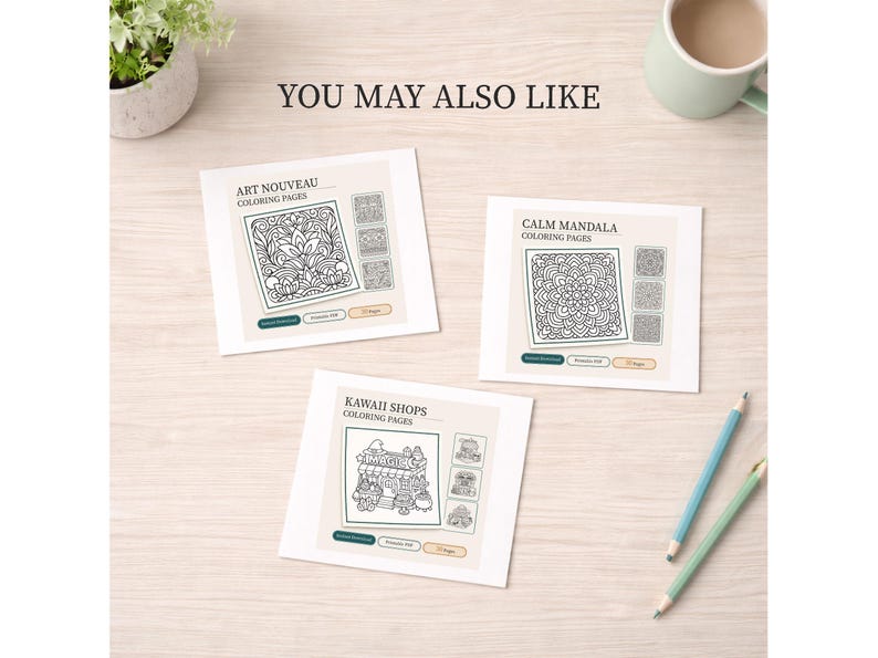 May include: Three coloring page designs are displayed on a light wooden surface. The pages are titled "Art Nouveau Coloring Pages", "Calm Mandala Coloring Pages", and "Kawaii Shops Coloring Pages". Two pencils and a mug are also visible.