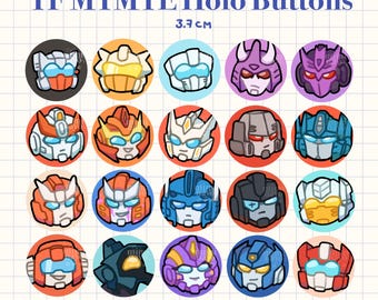 May include: A collection of 20 round holo buttons, each featuring a different cartoon robot face design. The buttons are approximately 1.45 inches in diameter, with a variety of colors including red, blue, orange, and purple. The text "TF MTMTE Holo Buttons" is at the top.
