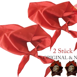 May include: Two red fabric neckerchiefs with a knotted design. The text "2 Stück ORIGINAL & NEU" is printed below the neckerchiefs. Two red and gold pins with a star and a portrait are shown below the text.