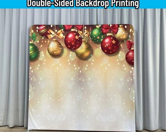 May include: A rectangular backdrop stand featuring a custom fabric cover with double-sided printing. The design displays red, green, and gold Christmas ornaments hanging against a blurred, glowing gold bokeh background with white light spots.